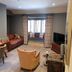Fence Gate Lodge in Burnley lounge with desk, armchair, sofa and window seat