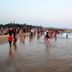 Calangute Residency, Calangute beach scene with crowds playing in the surf at sunset.