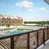 Balcony view at Wyndham Residences Tulum overlooking the pool and resort buildings
