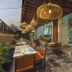 Yogi Executive, Navi Mumbai outdoor dining terrace with hanging lights and glass-walled restaurant