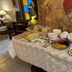 Breakfast buffet at Nubes Hotel in Viña del Mar with pastries, fruit, yogurt, and coffee service
