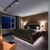 Skarsnuten Mountain Resort & Spa in Hemsedal room with wood accent wall, king bed and mountain-view window