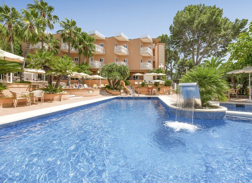 allsun Hotel Paguera Vera Beach in Peguera with outdoor pool, waterfall feature and palm trees