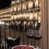 Salamanca Luxury Plaza in Salamanca, night view of illuminated historic plaza with wine glasses by the window