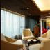 In One City Inn in Taichung City lounge with beige armchairs, coffee table, and colorful seating area