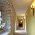 Burg Wanzleben hotel corridor with stone arch windows and wall sconces in Wanzleben-Börde