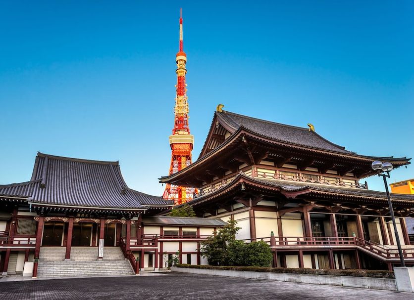 Hotel Mystays Hamamatsucho in Tokyo with Tokyo Tower behind traditional temple-style buildings