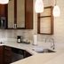 Residence Inn by Marriott Savannah Airport kitchen with stainless steel appliances and pendant lights
