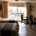 Hotel Graham Villahermosa guest room with two beds, desk, and garden-view window in Villahermosa