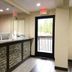 Red Carpet Inn - New Brunswick front desk with glass entry door and tiled lobby area