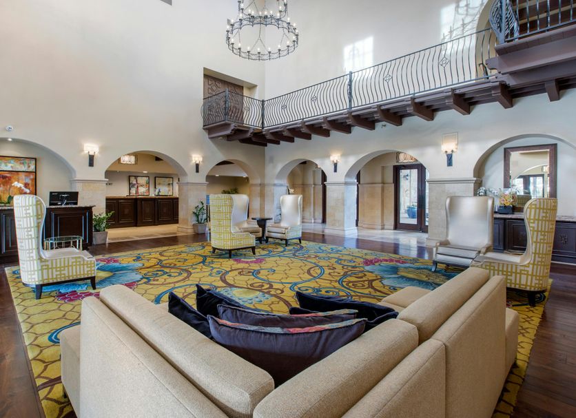 Omni Rancho Las Palmas Resort & Spa lobby with high ceilings, arches, seating area and mezzanine in Rancho Mirage