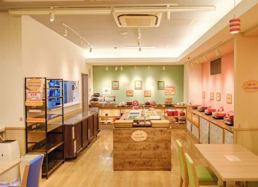Hotel Risingsun Miyakojima buffet dining area with self-serve counter and seating in Miyakojima