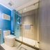 Home Inn Neo Shenzhen Dongmen Pedestrian Street Shaibu Metro Station bathroom with glass shower and blue tile in Shenzhen
