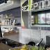ibis budget Köln Leverkusen City reception desk with TV screen and bar shelves in Leverkusen