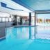 Indoor pool at Coast Victoria Hotel & Marina by APA in Victoria with floor-to-ceiling marina views