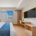 Aishangyijia Hotel (Wuhu Zhongshan Road Pedestrian Street Branch) room with city view, desk and wall TV