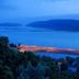 Kanonkop House in Knysna overlooking the bay and lit waterfront at dusk