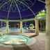 Hilton Grand Vacations Club Parc Soleil Orlando courtyard pool with circular spa and columns at night