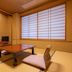 Suminoyu in Yamanouchi tatami room with low table, floor cushions and shoji windows