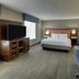 Hampton Inn & Suites St. Louis-Edwardsville in Glen Carbon guest room with king bed, TV and desk