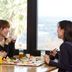 Guests dining at Hotel Sekia in Nankan with a bright window view