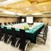 Orchardz Hotel Industri Jakarta meeting room with U-shaped conference table and projector screen