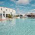 Sandos Papagayo Beach Resort in Playa Blanca with a large outdoor pool and resort buildings