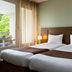 Residence La Reserve in Ferney-Voltaire guest room with twin beds and balcony view