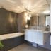 Surfers Plaza Resort, Surfers Paradise bathroom with bathtub, vanity sink and mirror