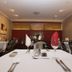 James Street Motor Inn Toowoomba restaurant with white-tablecloth dining tables and red accent wall