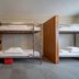 Loft - Hi Eco Hostel Reykjavik dorm room with bunk beds and shared wardrobe space