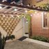 Ocean Praia Hotel in Fortaleza exterior with brick facade, string lights, and potted wall decor