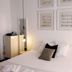 Casa de Huéspedes Santa María in El Puerto de Santa María: bright room with white bed, hanging lamps and framed art