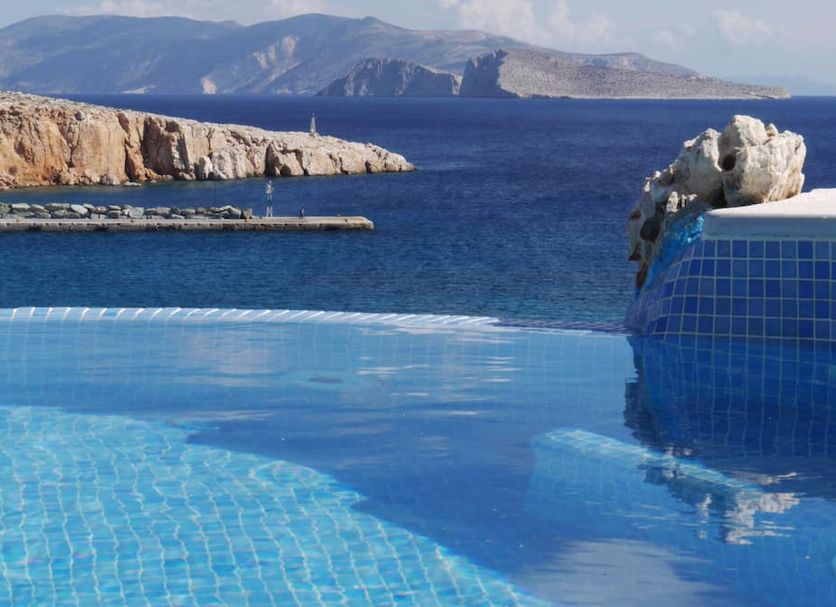 Vrahos Boutique Hotel in Folegandros with infinity pool overlooking the sea and rocky coastline