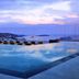 Myconian Korali Relais & Chateaux in Mykonos: infinity pool overlooking the sea at sunset