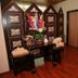 Sharjah Palace Hotel in Sharjah with a spa treatment room, massage table and decorative wooden screen