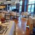 Hotel Mare Takata restaurant dining room in Maizuru with set tables and large windows