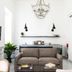 Carmelita Valletta lounge with sofa, chandelier, wall-mounted TV and kitchenette in Valletta