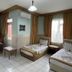 Best Life Apart Hotel Alanya room with two single beds, sofa, windows, and tiled floor