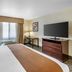 Best Western PLUS Truckee-Tahoe Hotel guest room with king bed, TV, desk, and window seating in Truckee