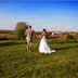 Annville Inn Bed and Breakfast in Annville, couple in wedding attire walking across a grassy lawn