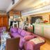 Logis Auberge La Cremaillere in Villandraut lounge with purple sofa, bar counter and stone fireplace