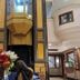 Hotel The Taksonz lobby in Ludhiana with floral arrangement and ornate central elevator