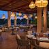 Dreams Aventuras Riviera Maya in Puerto Aventuras, open-air restaurant with hanging lanterns and poolside seating