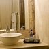 Las Iglesias Antigua bathroom vanity with vessel sink, mirror and toiletries