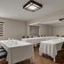 Meeting room at Baymont by Wyndham Branford/New Haven in Branford with set tables and chairs