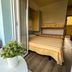 Hotel & Residence Parador Cesenatico balcony with table, potted plant and view into a bedroom