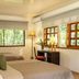 Natural Lodge Caño Negro guest room with two beds, large windows, and garden views in Caño Negro