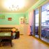 Ct Theme Suite in Kaohsiung City: bright suite with sectional sofa, coffee table, and balcony access