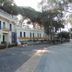 Hotel Zeus in Pompei exterior with terrace balconies and tree-lined driveway